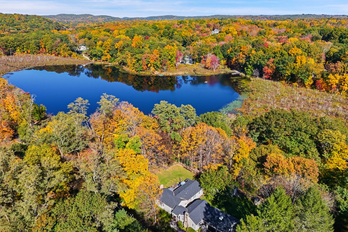 82 Simpaug Turnpike Redding CT 06896 — 3 bed 2 bath home for sale, 1905 sqft on .47 acres with views of Umpawaug Pond, listed at $749,000 by Alex Capozzoli Keller Williams Realty